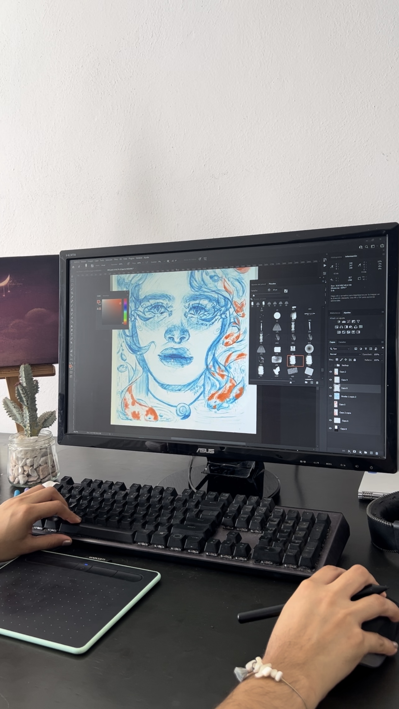 Alejandra's desktop setup with a designer doing mixed medio intervention of an ink portrait in Photoshop.